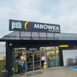 Widok zewnętrzny sklepu PSB Mrówka Express w Karsinie z logo Grupy PSB i oznaczeniem formatu Express